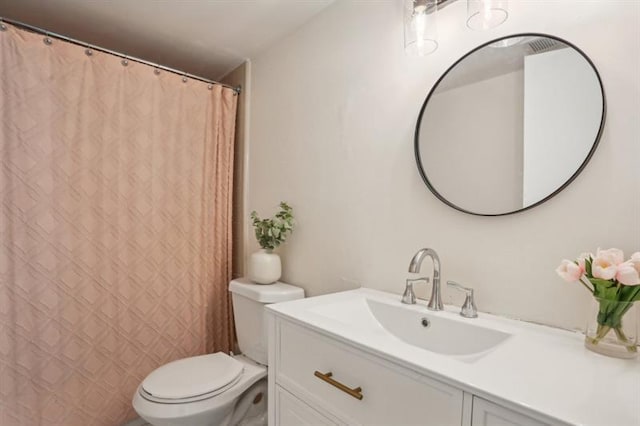 full bathroom featuring vanity and toilet