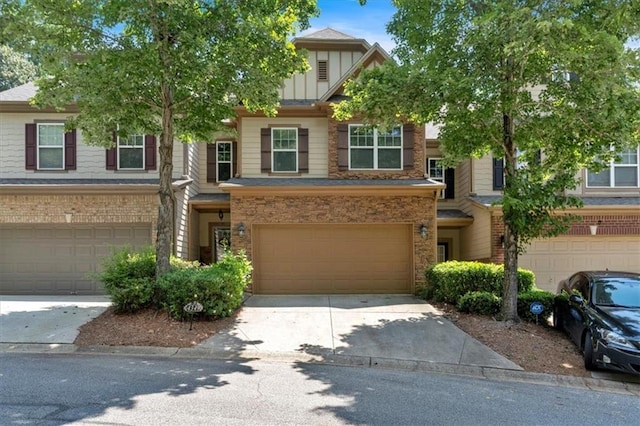 4349 Kousa Rd Unit 4, Austell, GA 30106 - townhome / multi-family property with a garage, concrete driveway, and brick siding