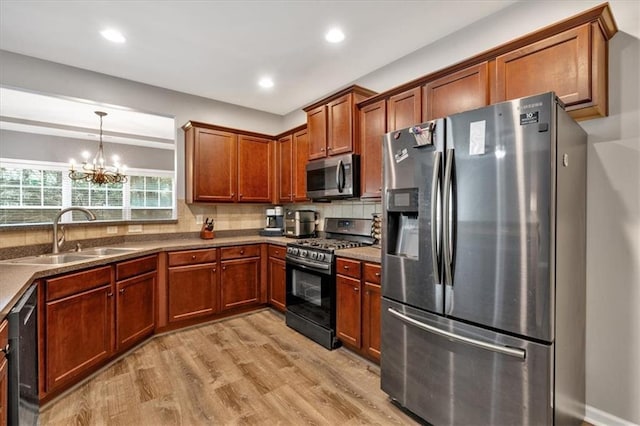 4349 Kousa Rd Unit 4, Austell, GA 30106 - kitchen featuring stainless steel appliances, light wood finished floors, a chandelier, decorative backsplash, and brown cabinets