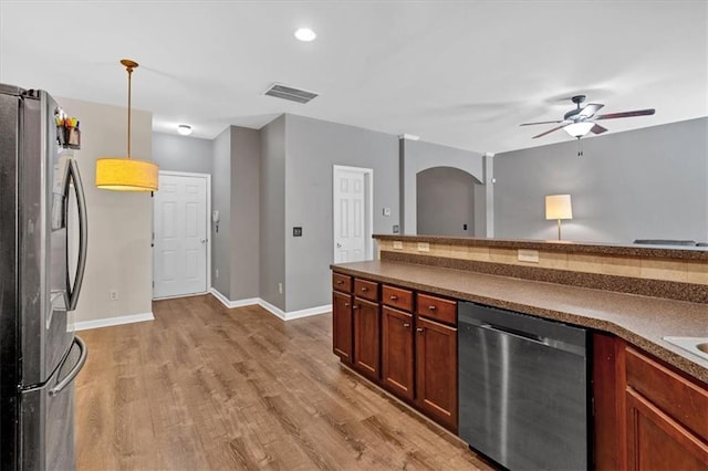 4349 Kousa Rd Unit 4, Austell, GA 30106 - kitchen featuring appliances with stainless steel finishes, dark countertops, light wood-style floors, ceiling fan, and decorative light fixtures