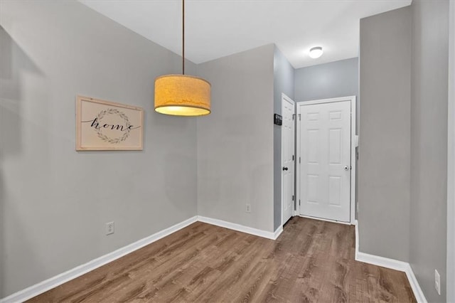 4349 Kousa Rd Unit 4, Austell, GA 30106 - unfurnished dining area featuring wood finished floors and baseboards
