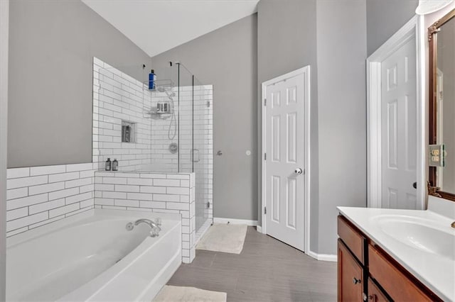 4349 Kousa Rd Unit 4, Austell, GA 30106 - full bathroom featuring a stall shower, a bath, vanity, and lofted ceiling