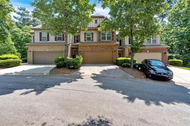 4349 Kousa Rd Unit 4, Austell, GA 30106 - view of front of home with an attached garage, brick siding, and driveway