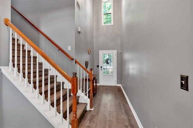 4349 Kousa Rd Unit 4, Austell, GA 30106 - foyer entrance with wood finished floors, stairs, and a high ceiling