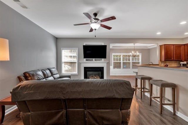 4349 Kousa Rd Unit 4, Austell, GA 30106 - living area featuring a chandelier, ceiling fan, dark wood-style flooring, recessed lighting, and a glass covered fireplace