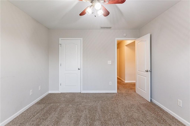 unfurnished bedroom with carpet and ceiling fan