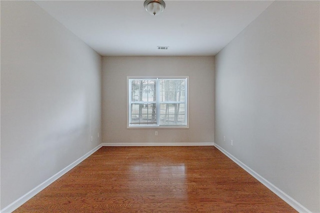 empty room featuring wood-type flooring