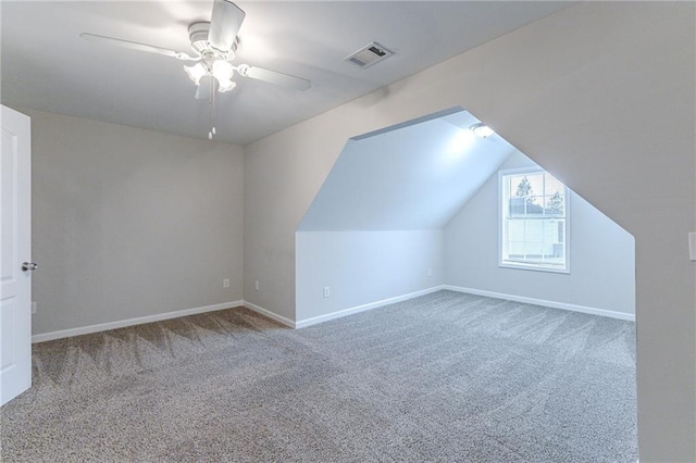 bonus room with ceiling fan, carpet, and lofted ceiling