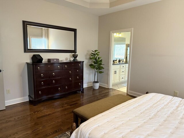 410 Spring Lake Hls, Canton, GA 30114 - bedroom featuring baseboards, ensuite bath, and wood finished floors