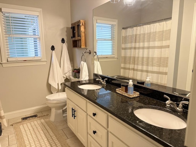 410 Spring Lake Hls, Canton, GA 30114 - full bathroom featuring toilet, a sink, tile patterned floors, and visible vents