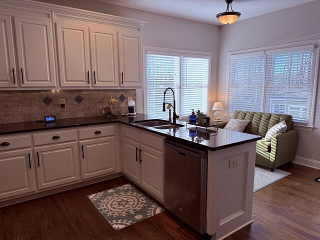 410 Spring Lake Hls, Canton, GA 30114 - kitchen with a sink, dark countertops, a peninsula, and stainless steel dishwasher