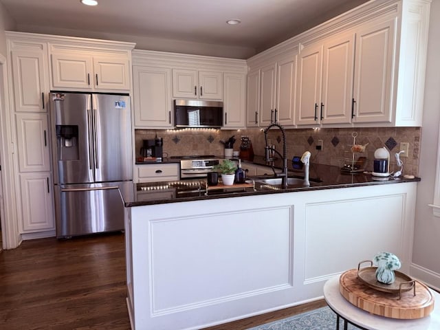 410 Spring Lake Hls, Canton, GA 30114 - kitchen with white cabinetry, a sink, stainless steel appliances, and a peninsula