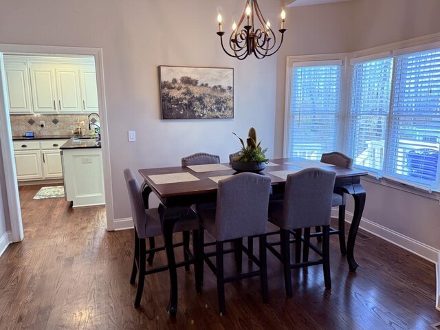410 Spring Lake Hls, Canton, GA 30114 - dining area with baseboards, dark wood-type flooring, and a chandelier