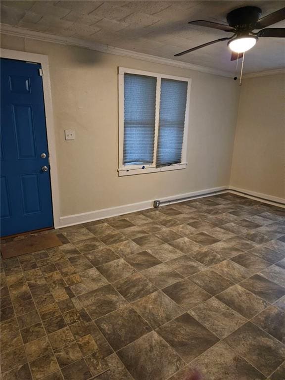 foyer featuring ceiling fan and ornamental molding