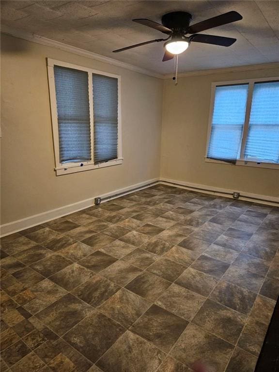 empty room featuring crown molding and ceiling fan