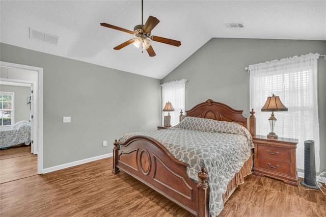1164 Otis Dr, Bethlehem, GA 30620 - bedroom with wood finished floors, vaulted ceiling, and a ceiling fan