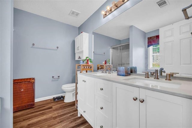 1164 Otis Dr, Bethlehem, GA 30620 - full bath featuring a shower stall, double vanity, and wood finished floors