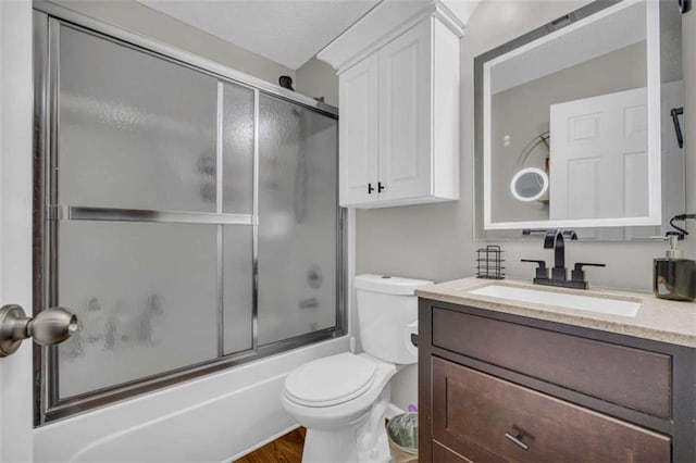 1164 Otis Dr, Bethlehem, GA 30620 - bathroom with vanity, bath / shower combo with glass door, and wood finished floors