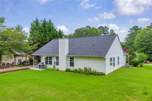 1164 Otis Dr, Bethlehem, GA 30620 - rear view of house featuring a pergola, a lawn, a chimney, roof with shingles, and a wooden deck