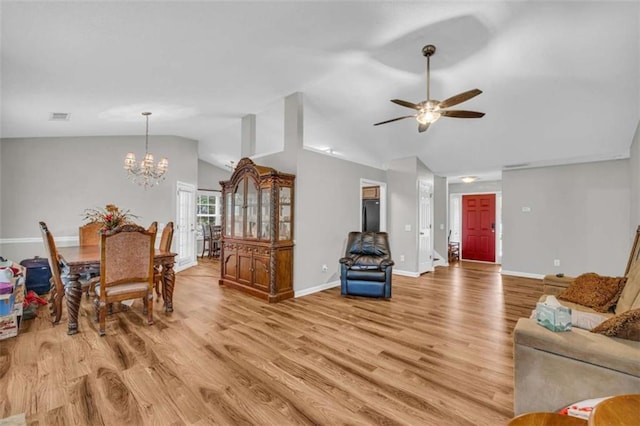 1164 Otis Dr, Bethlehem, GA 30620 - living room featuring lofted ceiling, light wood finished floors, a ceiling fan, and a chandelier