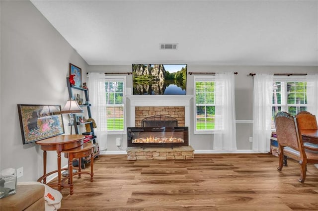 1164 Otis Dr, Bethlehem, GA 30620 - sitting room featuring wood finished floors, a fireplace, and plenty of natural light