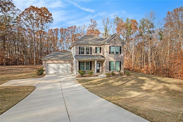 view of front of house featuring a garage and a front lawn