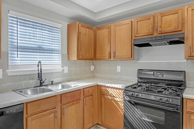 kitchen with sink, black appliances, light brown cabinets, and tasteful backsplash