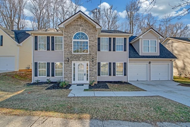 view of front facade featuring a front lawn and a garage