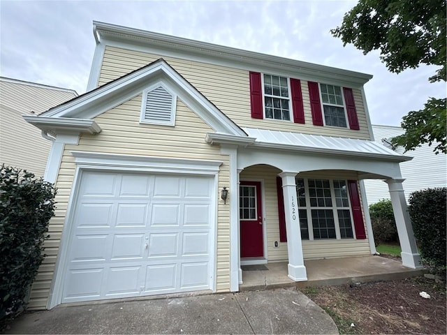 view of front of house with a garage and covered porch