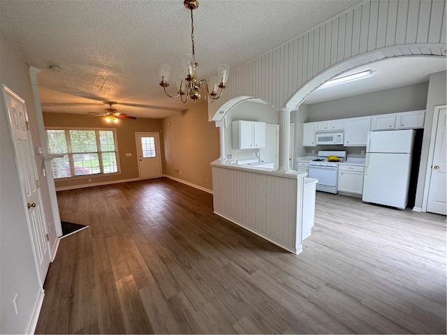 kitchen featuring white cabinetry, white appliances, a textured ceiling, ceiling fan with notable chandelier, and light hardwood / wood-style floors