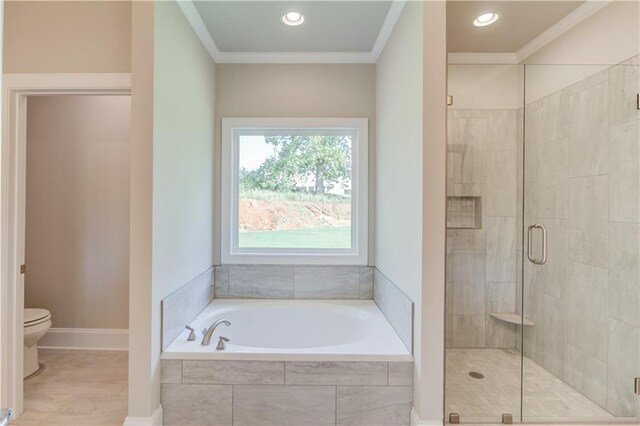 bathroom with wood-type flooring, crown molding, toilet, and shower with separate bathtub