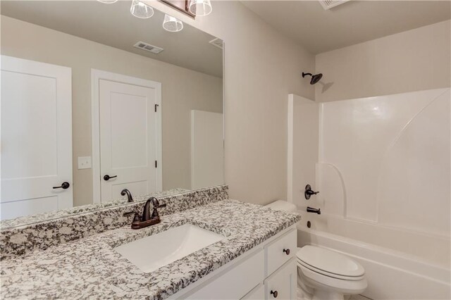 full bathroom with vanity with extensive cabinet space, toilet, and bathing tub / shower combination