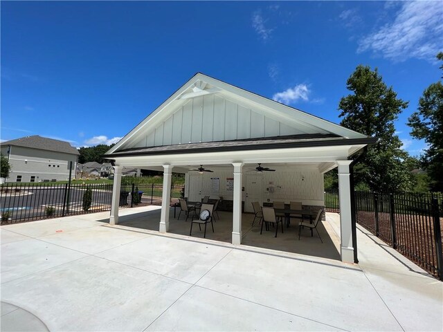 exterior space with ceiling fan