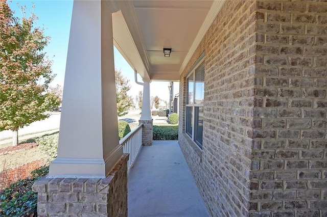 view of side of property with a porch