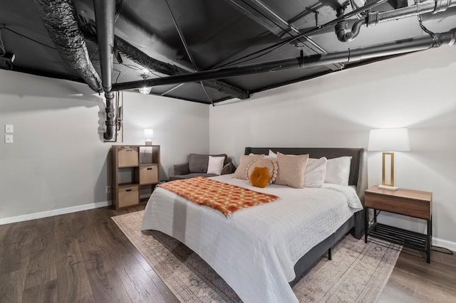 bedroom with hardwood / wood-style flooring