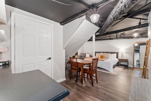 bedroom featuring dark hardwood / wood-style flooring