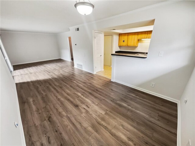 unfurnished living room with dark hardwood / wood-style floors