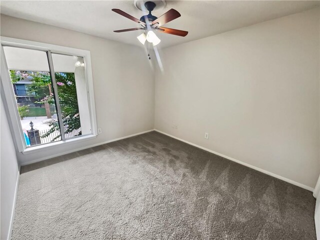 spare room with ceiling fan and carpet floors