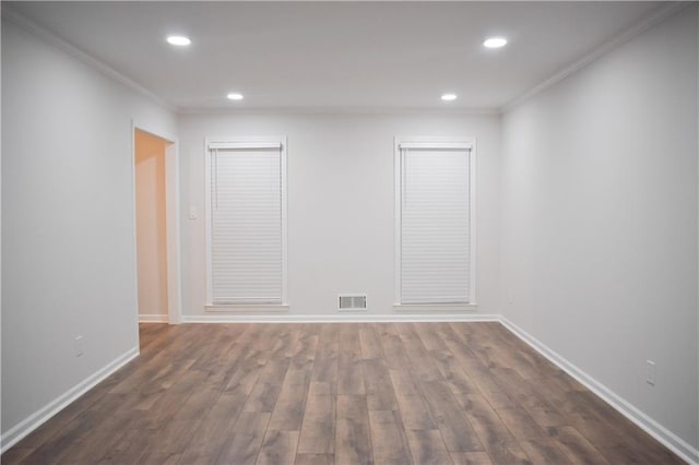 unfurnished room with dark hardwood / wood-style flooring and ornamental molding