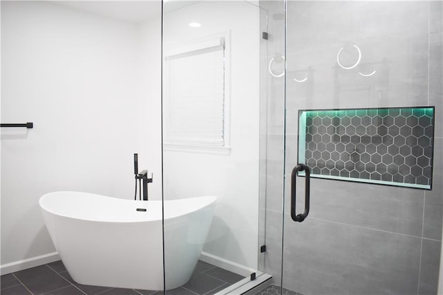 bathroom featuring tile patterned flooring and independent shower and bath