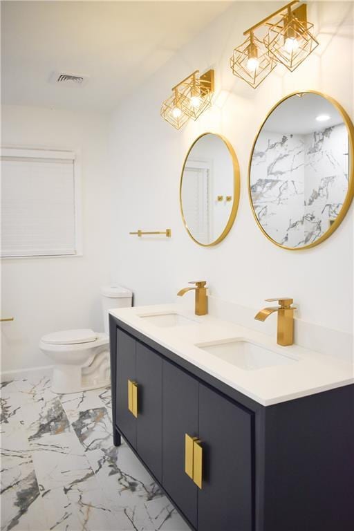 bathroom with vanity and toilet