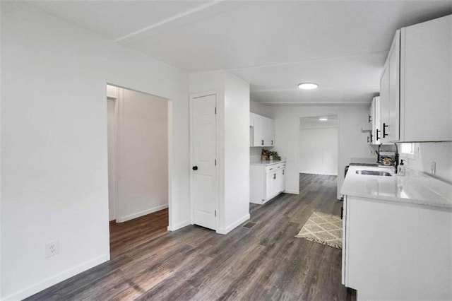 118 Buck Creek Cir, Griffin, GA 30224 - kitchen with dark wood finished floors, light countertops, white cabinetry, and recessed lighting