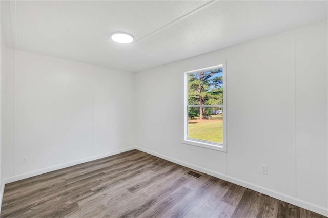 118 Buck Creek Cir, Griffin, GA 30224 - empty room with wood finished floors and baseboards