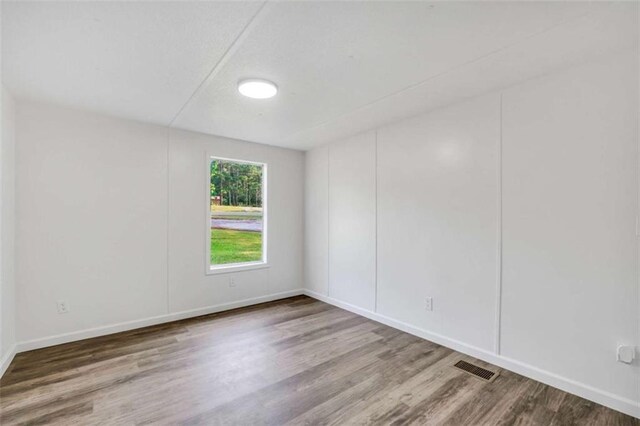 118 Buck Creek Cir, Griffin, GA 30224 - empty room featuring wood finished floors and baseboards
