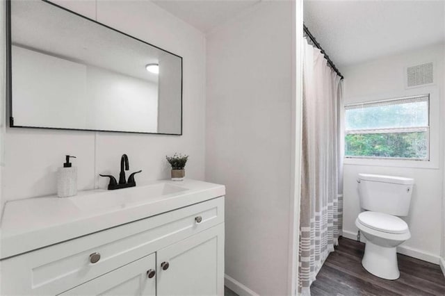 118 Buck Creek Cir, Griffin, GA 30224 - full bathroom featuring vanity, wood finished floors, and curtained shower