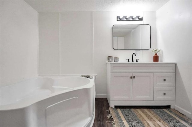 118 Buck Creek Cir, Griffin, GA 30224 - bathroom with vanity, a bath, and wood finished floors