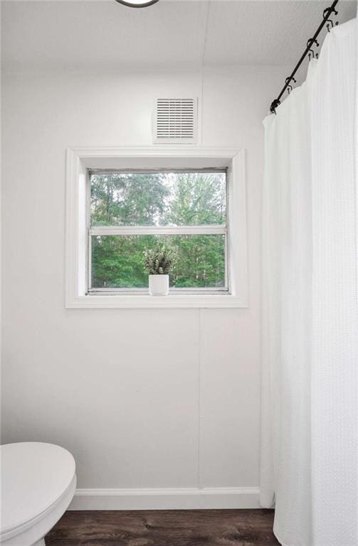 118 Buck Creek Cir, Griffin, GA 30224 - bathroom featuring wood finished floors and curtained shower