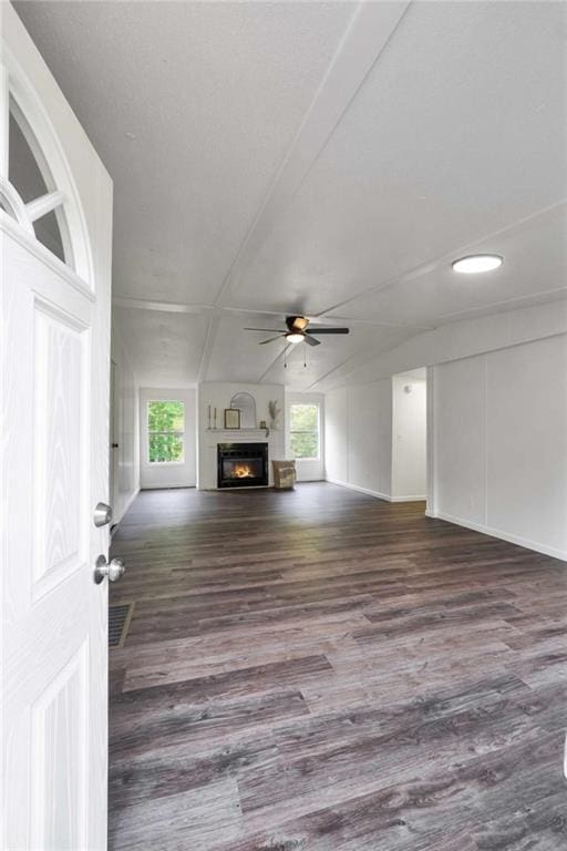 118 Buck Creek Cir, Griffin, GA 30224 - unfurnished living room featuring a ceiling fan, plenty of natural light, wood finished floors, and a glass covered fireplace