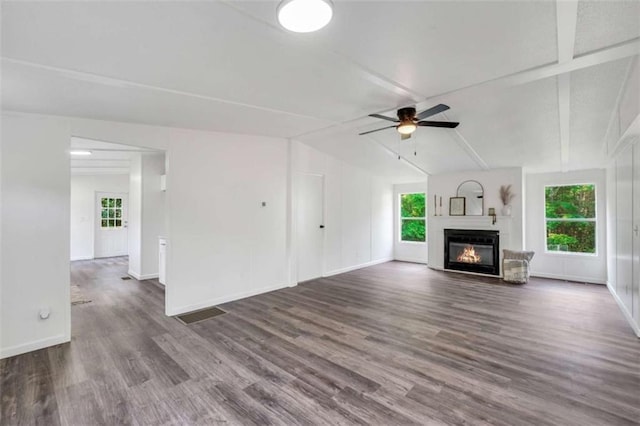118 Buck Creek Cir, Griffin, GA 30224 - unfurnished living room with a glass covered fireplace, wood finished floors, and a ceiling fan