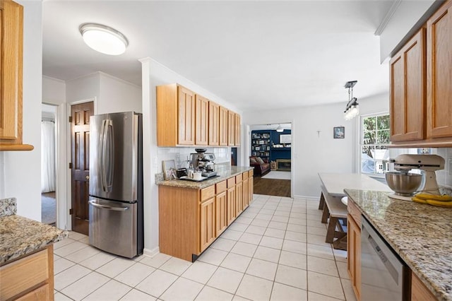 kitchen with light stone counters, light tile patterned floors, ornamental molding, decorative backsplash, and stainless steel appliances